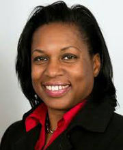 headshot photo of professor Katrina Huff-Larmond smiling with medium length straight black hair and wearing a red button down shirt under a black blazer