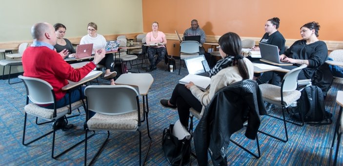 Political Science class with desks arranged in a circle