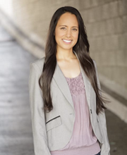 Christina Hodel standing and smiling