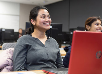 A woman smiling in class