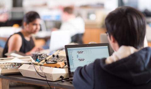 students working in computer science class