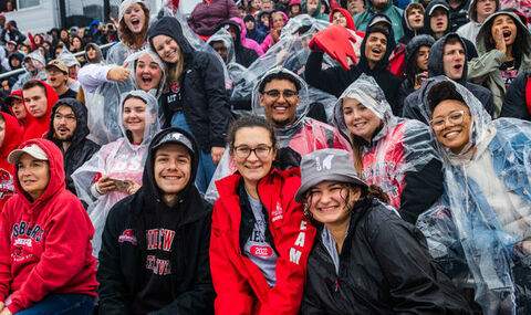 Homecoming fans cheer for the BSU Bears in the rain