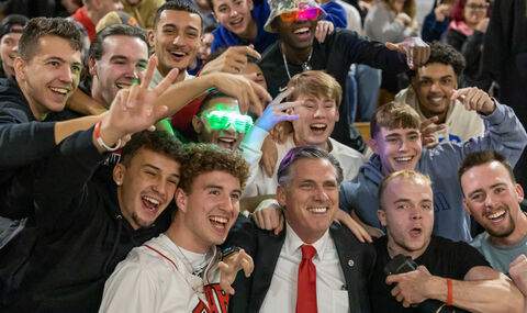 President Clark surrounded by enthusiastic students at Midnight Madness