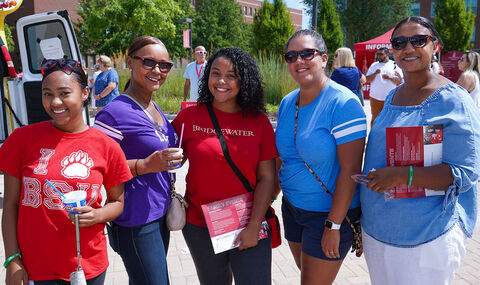 Parents and students posing at the block party