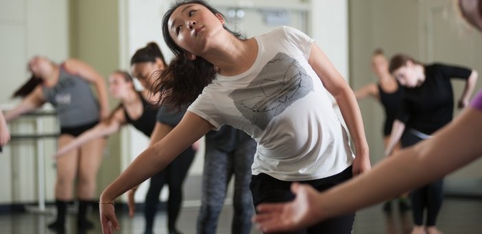 Students at barre stretching