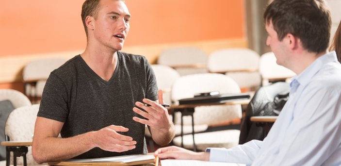 A student practicing counseling with another student