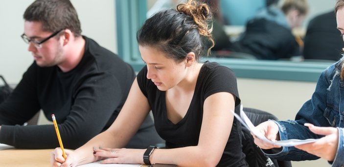 Students taking notes in class